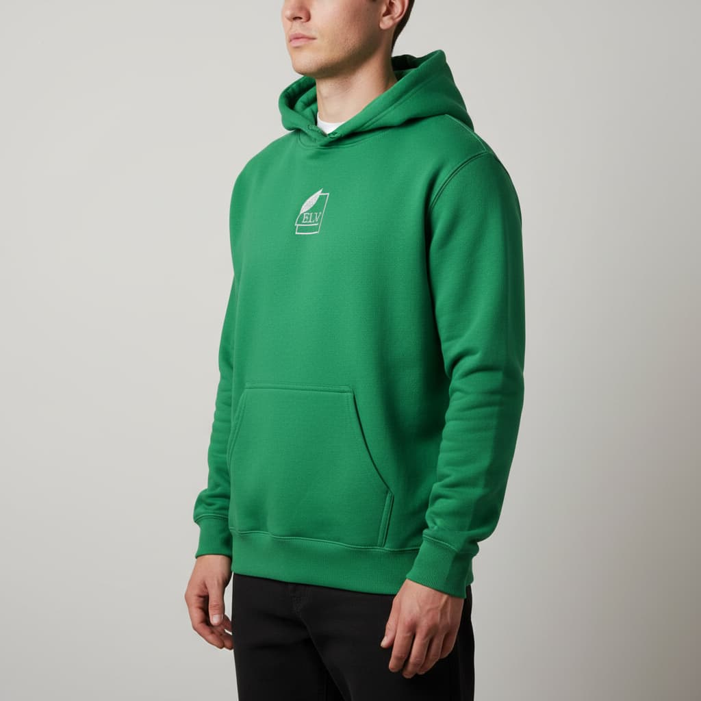 Person wearing a green hoodie with a logo on a plain background