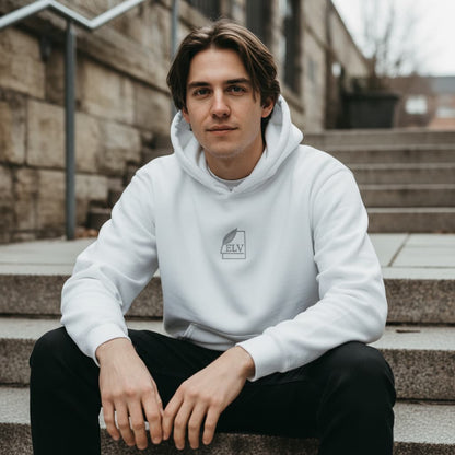 Person wearing a white hoodie with a logo sitting on steps outdoors